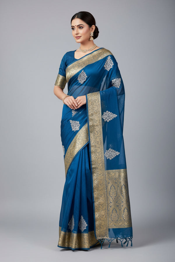Blue saree with gold border and white floral patterns, partially draped over a Buddha statue.